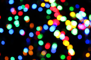 Abstract background. Multicolored bokeh on a black background