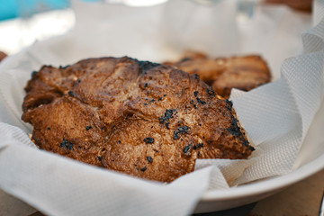 golden fried fish, is swordfish on white napkins on a white plate
