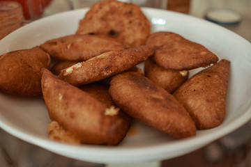 Venezuelan empanadas made of corn meal and stuffed with shredded beef and cheese, deep fried