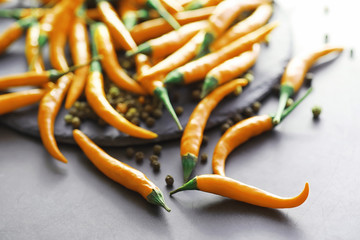 Hot orange pepper. Chilean pepper on a black.