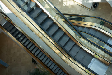 Top view of escalators in an urban shopping mall.