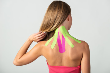 Obraz premium Kinesio tapes on the young woman's back