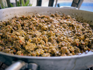 Meat, chicken and pork stew. Essential ingredient for the Venezuelan hallacas made in a big pan, saucepan, casserole, skillet, stewpan, stewpot