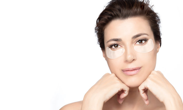 Beautiful Woman Face With Patches Under Eyes. Anti aging skin care concept
