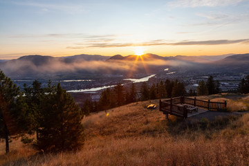 Fototapeta premium Beautiful View of a Canadian City, Kamloops, during a colorful summer sunrise. Located in the Interior British Columbia, Canada.