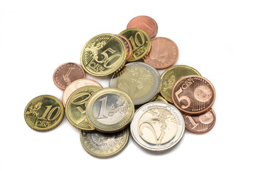 A pile of assorted Euro coins, close up, in macro, shot against a clean, white background