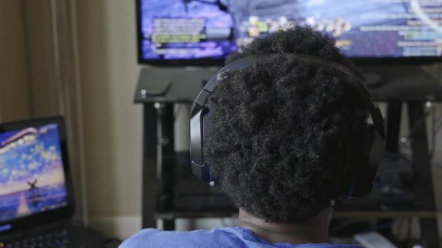Black man playing video game