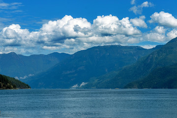 Clouds roll over the mountains near Earl's Cove, BC