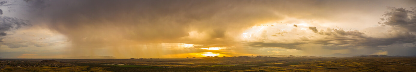A panorama of a monsoon at sunset over the Sonoran desert of Arizona.