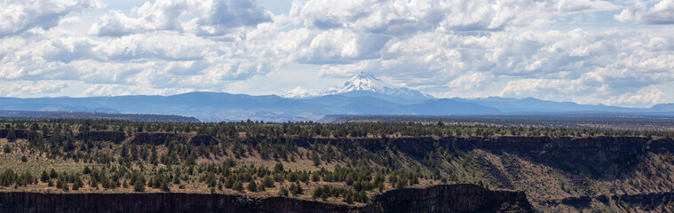 Beautiful View of The Cove Palisades State Park during a cloudy and sunny summer day. Taken in Oregon, United States of America.