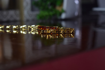 Gold bracelet Decorated with genuine gemstones that are expensive and rare for those who like...