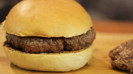 Very simple homemade burger on a wooden board