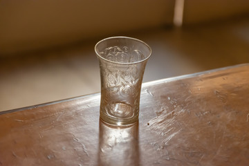 Small Antique Glass on wooden table