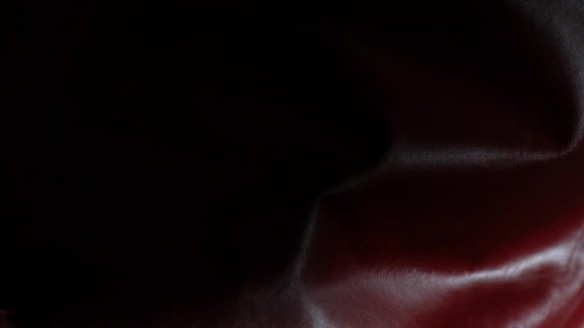 Red leather texture in super slow motion