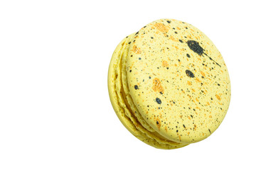 Colorful yellow macaroons isolated on white background.