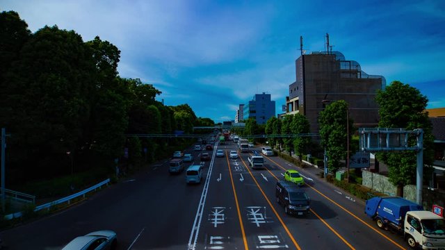 A timelapse of downtown street at Kanpachi avenue in Tokyo daytime wide shot zoom