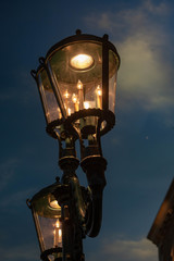 Fototapeta na wymiar Glowing steet lights at night
