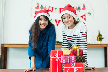Group of friends celebrate Christmas and give gifts.