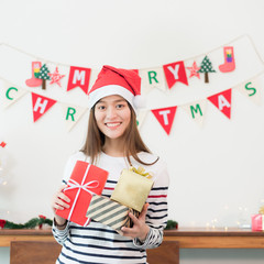 Young asian women holding gift boxes, Christmas.