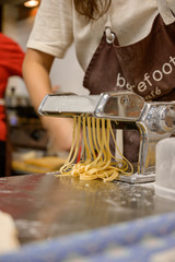 woman hand roll fettuccine pasta cutter , fettuccine handmade