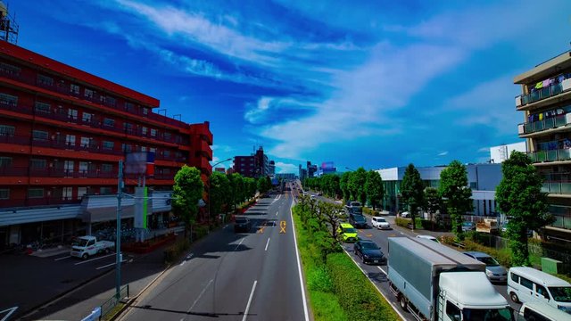 A timelapse of downtown street at Kanpachi avenue in Tokyo daytime wide shot zoom