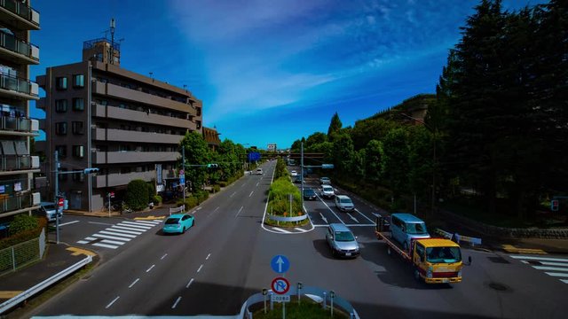 A timelapse of downtown street at Kanpachi avenue in Tokyo daytime wide shot zoom