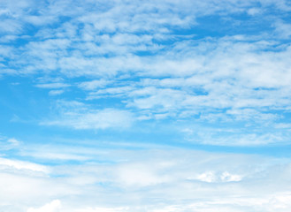 blue sky background with tiny clouds