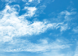 blue sky background with tiny clouds