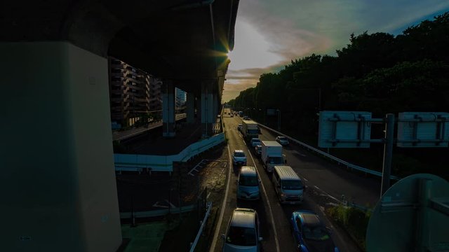 A timelapse of downtown street at Kanpachi avenue in Tokyo daytime wide shot zoom