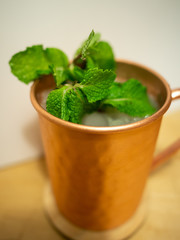 close view of Moscow Mule cocktail in copper mug