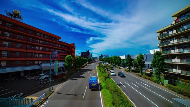A timelapse of downtown street at Kanpachi avenue in Tokyo daytime wide shot