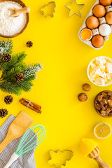 Baking frame. Ingredients and utensil on yellow background top view copy space