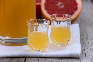 Homemade pink grapefruit liqueur, digestive liqueur