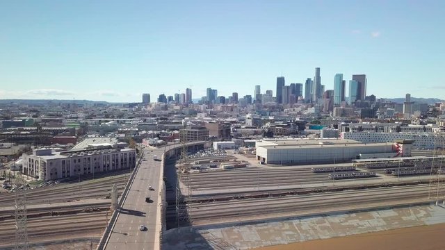 Wide aerial panorama of downtown Los Angeles from the LA River and Warehouse District. 4K