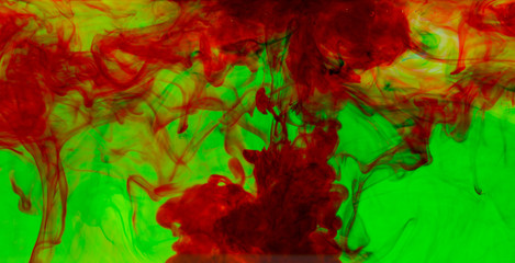 Abstract motion color water drop in water, Ink swirling in water background