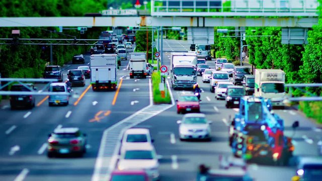 A timelapse of downtown street at Kanpachi avenue in Tokyo daytime tilt-shift panning