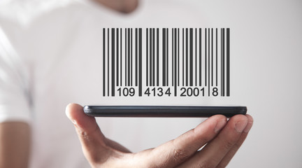 Businessman showing bar code. Warehouse, logistic and financial concept