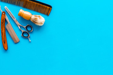Men's hairdressing. Equipment on blue background top view copy space