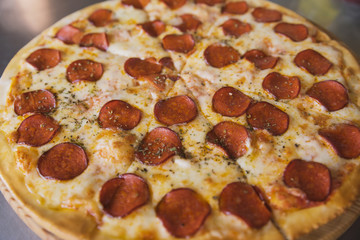 juicy pepperoni pizza and 4 cheeses in a package and on the table