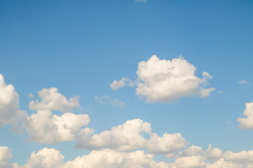 Naklejka na ściany i meble Blue sky with white beautiful cumulus clouds. Landscape sky clouds, background.
