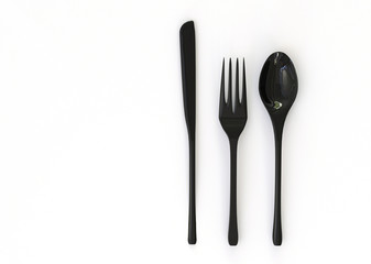 3d black fork, knife and spoon isolated on white background.