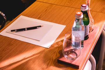 meeting room notebook and pen on wooden table 