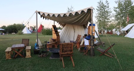 Rocky Mountain Man Rendezvous pioneer tent camping. 19th century fur trading outpost. Oregon, California and Mormon Trails. Pioneer, wilderness attire, camping and  old trapper skills.