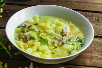 chicken soup farfalle - first course with pasta and vegetables, menu concept. food background. copy space