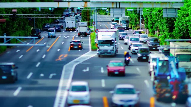 A timelapse of downtown street at Kanpachi avenue in Tokyo daytime tilt-shift zoom
