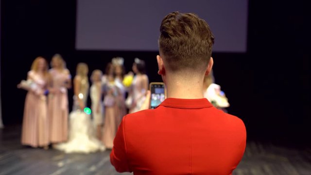 photo shoot of winner for International world, Miss Beauty Contest. Award ceremony of female woman girl model in dresses standing on stage victory win celebration. crown finalist of beauty contest 4 K