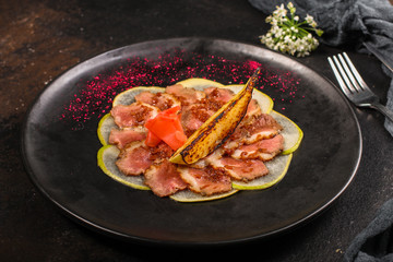 meat duck and pear, carpaccio (savory snack, gourmet cuisine) menu concept. food background. copy space. Top view