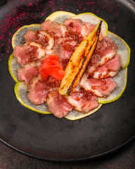 meat duck and pear, carpaccio (savory snack, gourmet cuisine) menu concept. food background. copy space. Top view