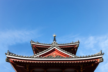 Fototapeta na wymiar Japan style tile roof with blue sky.