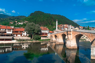 Fototapeta na wymiar Neretva River and Houses with Old Bridge